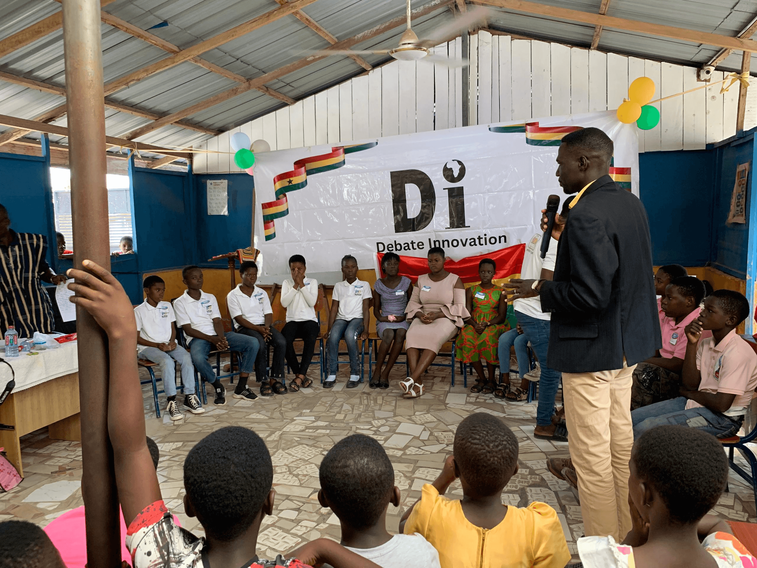 A speaker addressing students at a Debate Innovation tournament