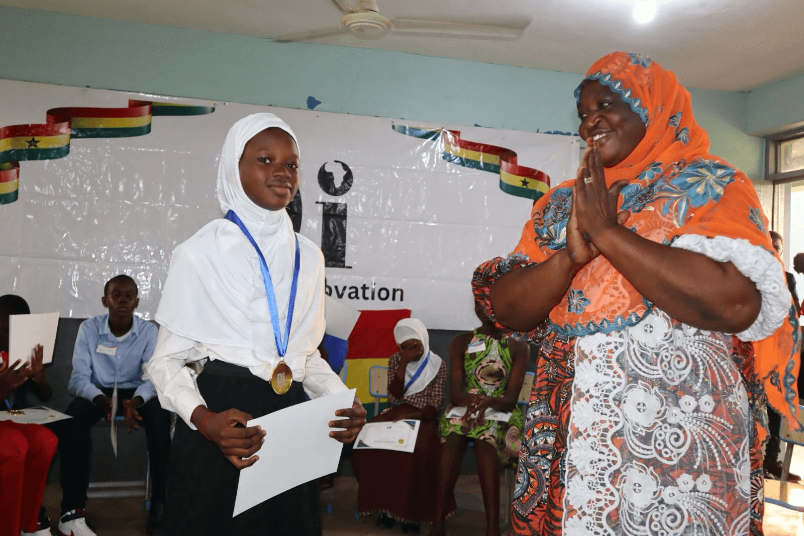 Congratulated by her head teacher